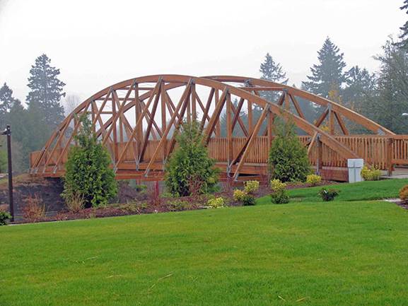 http://www.westernwoodstructures.com/wp-content/uploads/2012/12/_bowstring_truss_timber_bridge.jpg